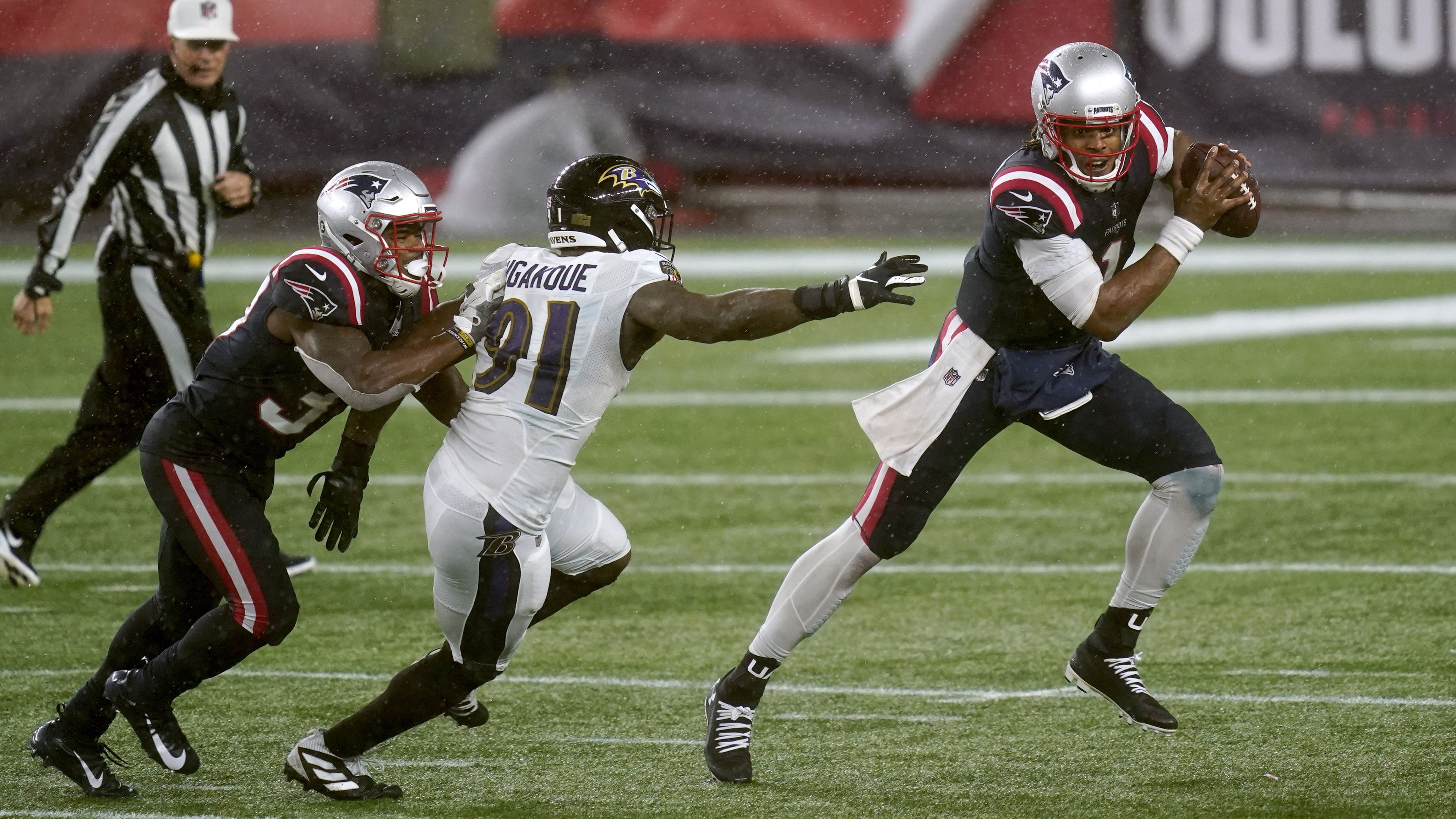 New England Patriots post soggy win over the Baltimore Ravens