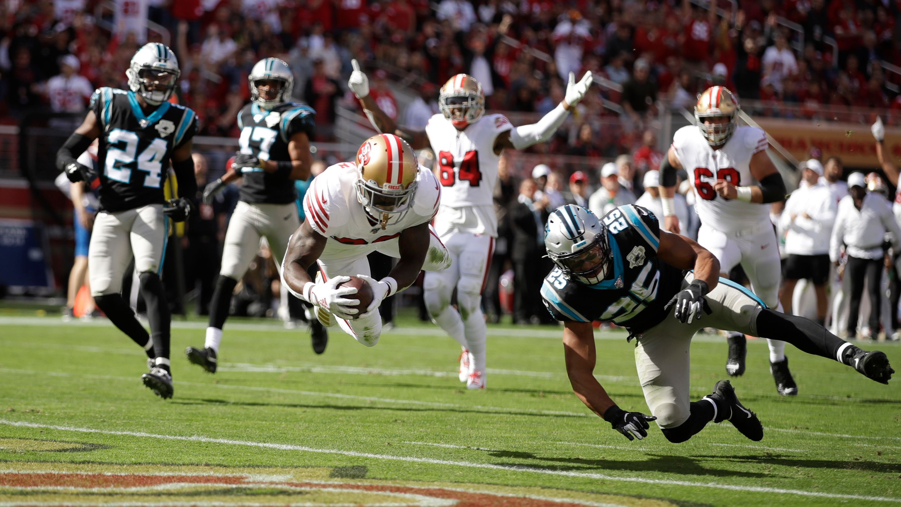 San Francisco 49ers running back Christian McCaffrey (23) walks on the  sideline during the second half of an NFL football game against the New  Orleans Saints in Santa Clara, Calif., Sunday, Nov.