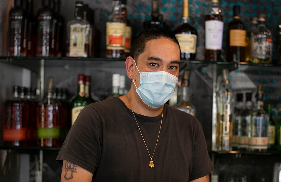 Danny Yant, left, owner of Quan Hapa in Over-the-Rhine, works behind the bar Tuesday, July 7, 2020. Yant, along with