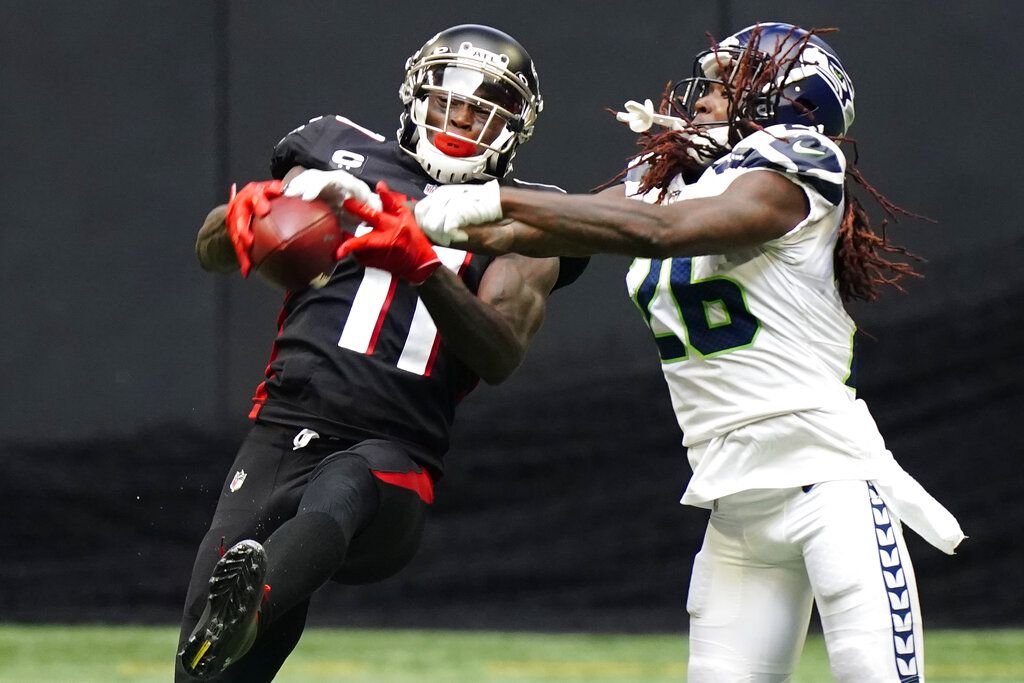 Tampa Bay Buccaneers wide receiver Julio Jones (6) runs a pass route  against Trevon Diggs (7) during an NFL football game against the Dallas  Cowboys on Sunday, September 11, 2022, in Arlington