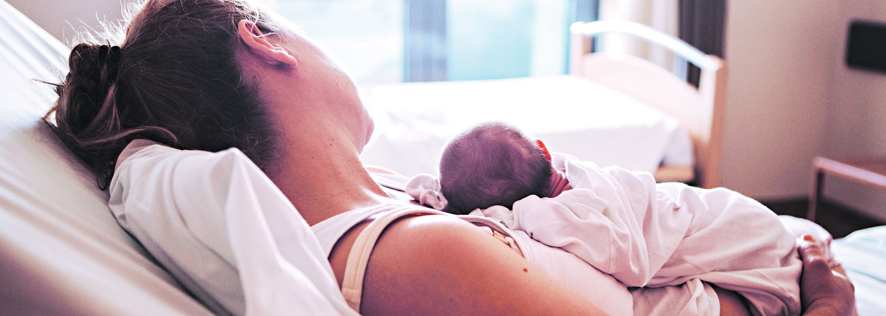 Mother with her newborn baby in the hospital