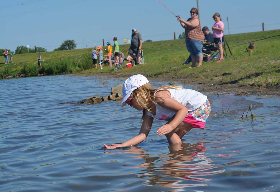 About 50 kids catch some memories at Quarry Springs Park Fishing Derby –  Newton Daily News