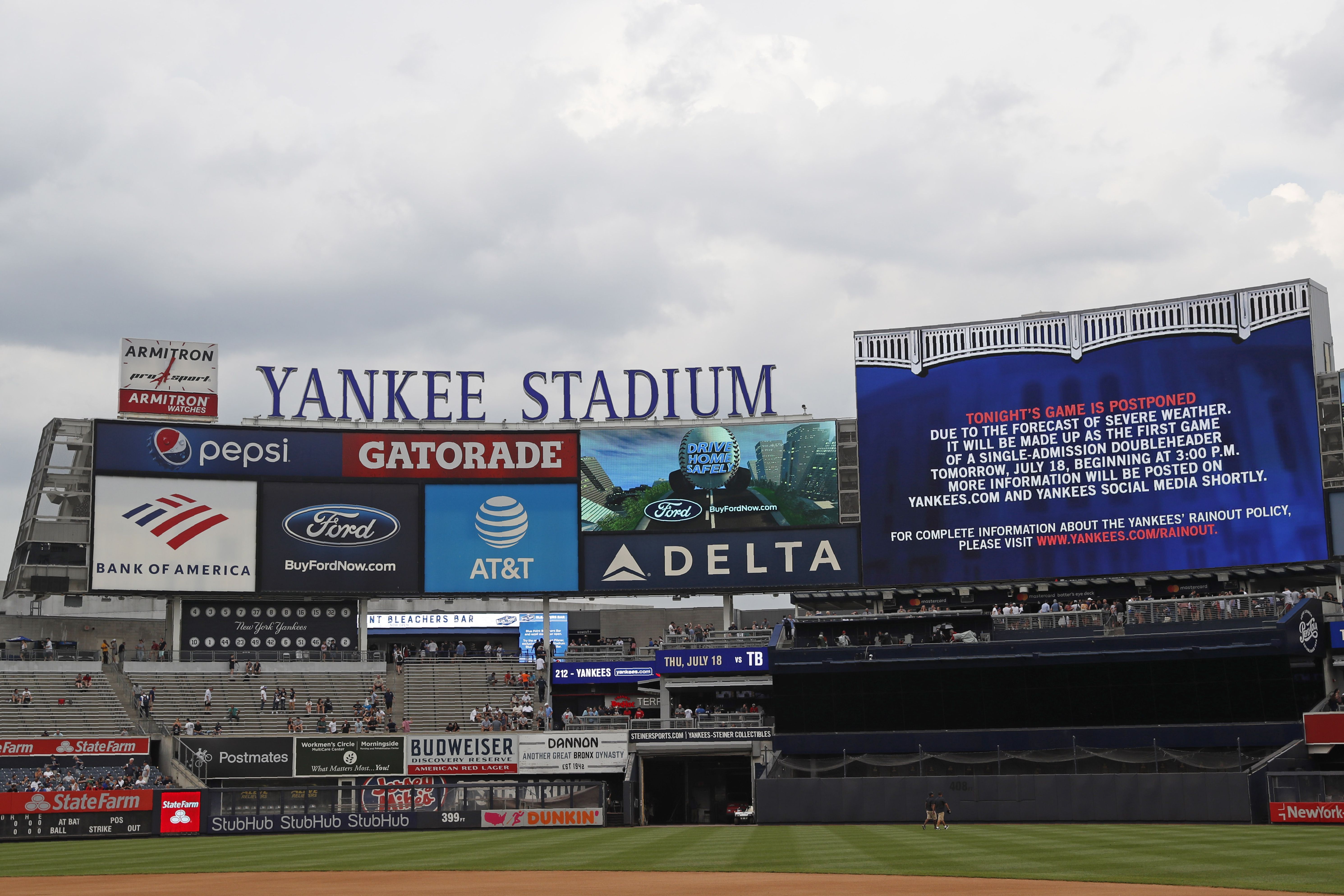 Photos: Fan rushes field during Rockies-Yankees game