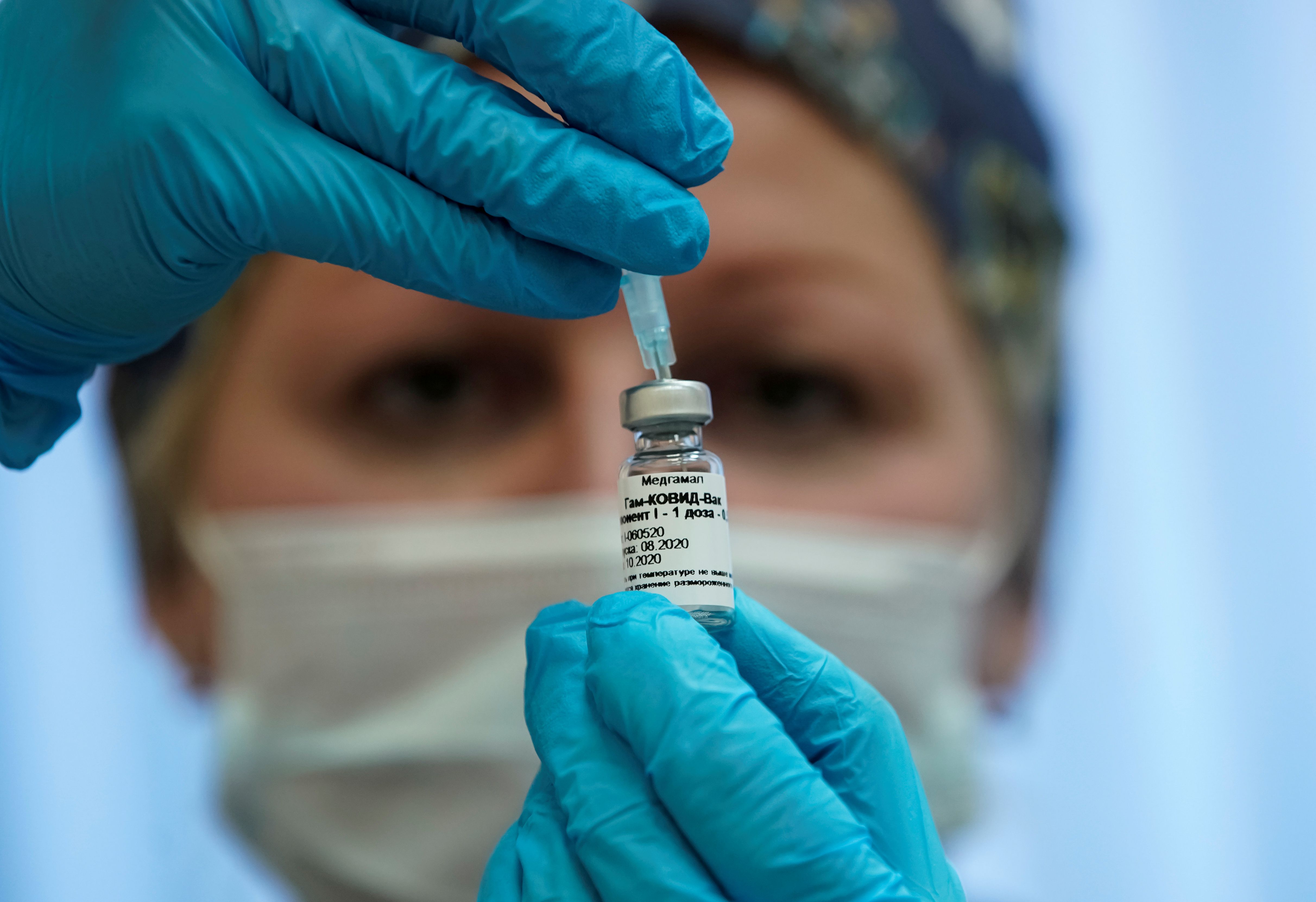 FILE PHOTO: A nurse prepares Russia's "Sputnik-V" vaccine against the coronavirus disease (COVID-19) for inoculation in a post-registration trials stage at a clinic in Moscow