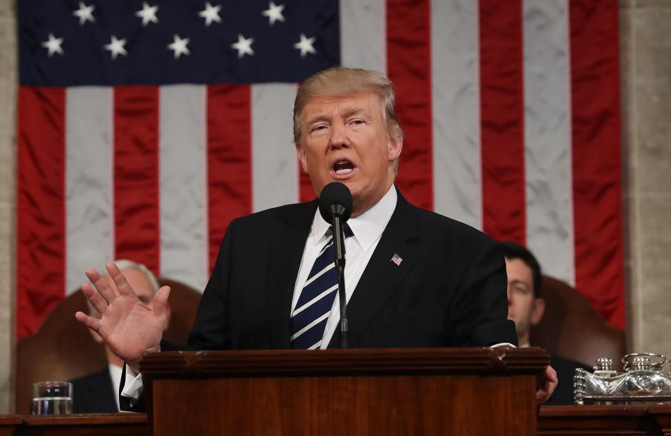 US President Donald J. Trump arrives to delivers his first address to a joint session of Congress from the floor of the House of Representatives in Washington