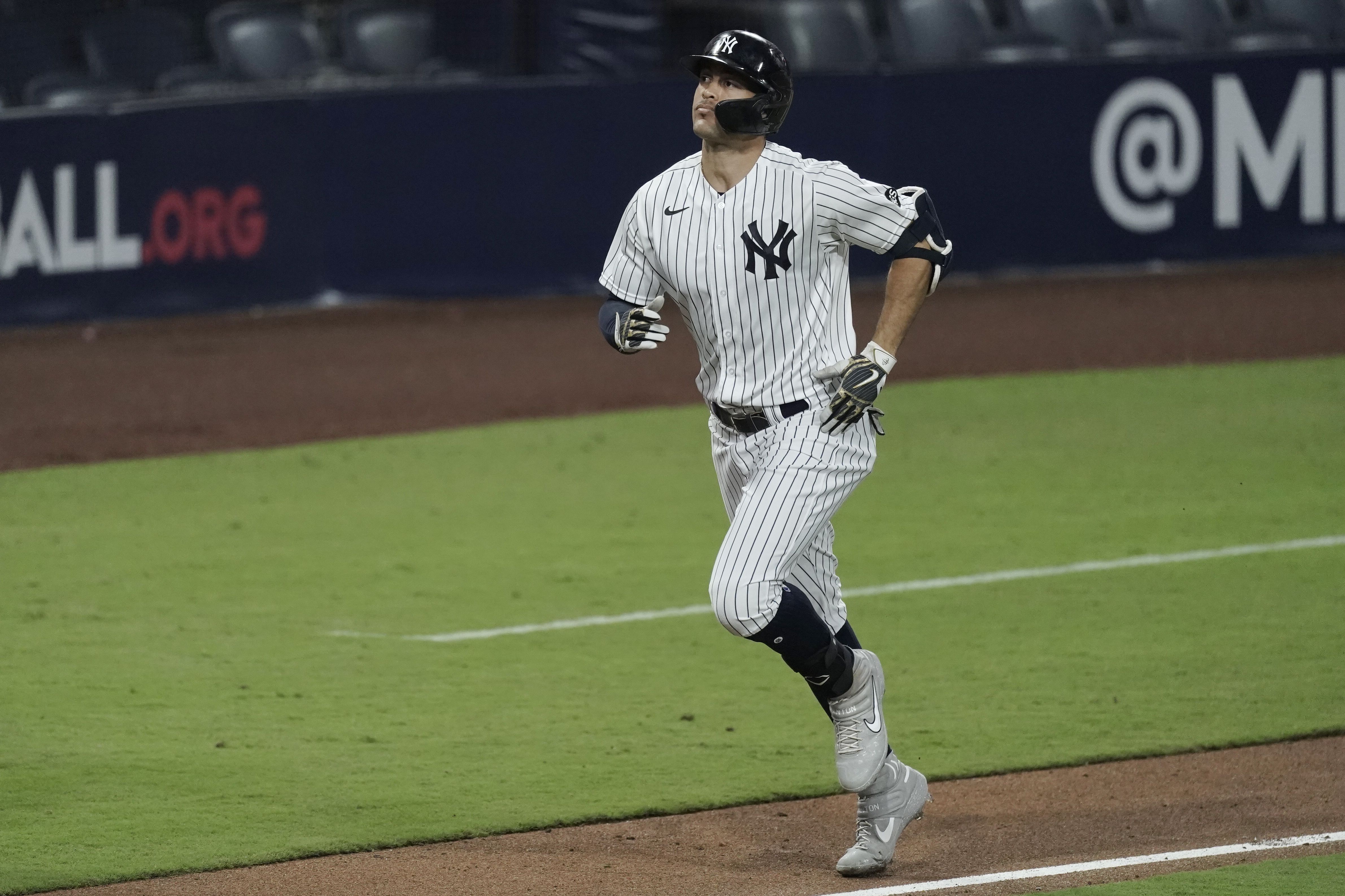 Giancarlo Stanton homers in fourth straight postseason game