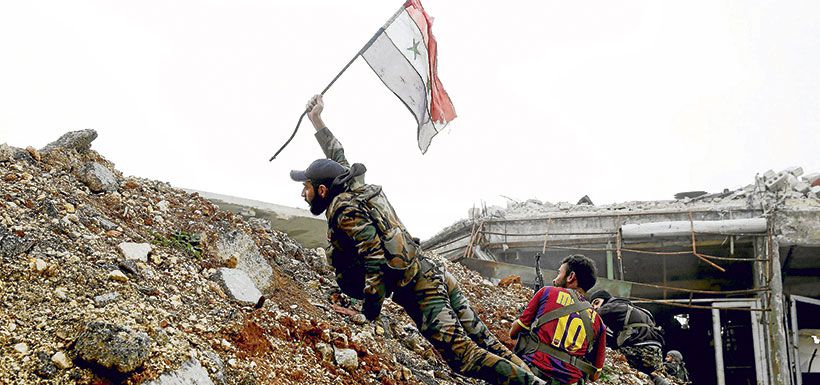 file-a-syrian-army-soldier-places-a-syria-36177742