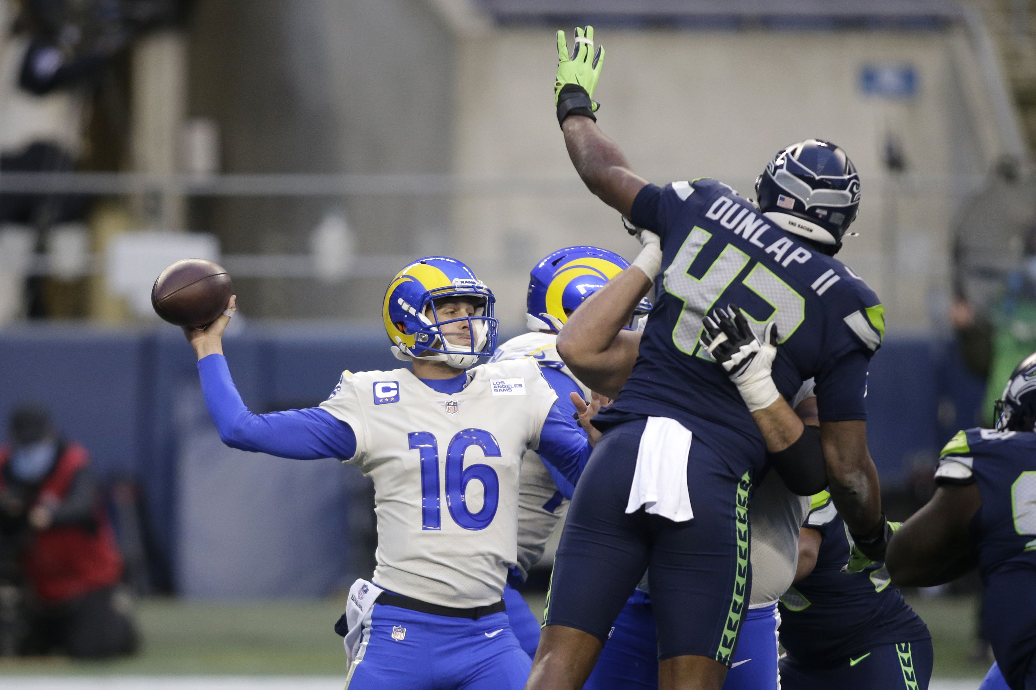 Los Angeles Rams head coach Sean McVay talks to quarterback John Wolford (13)  before an NFL