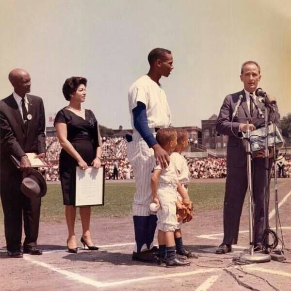 Ernie Banks and family feb. 16 he holds twins Joel and Jerry while