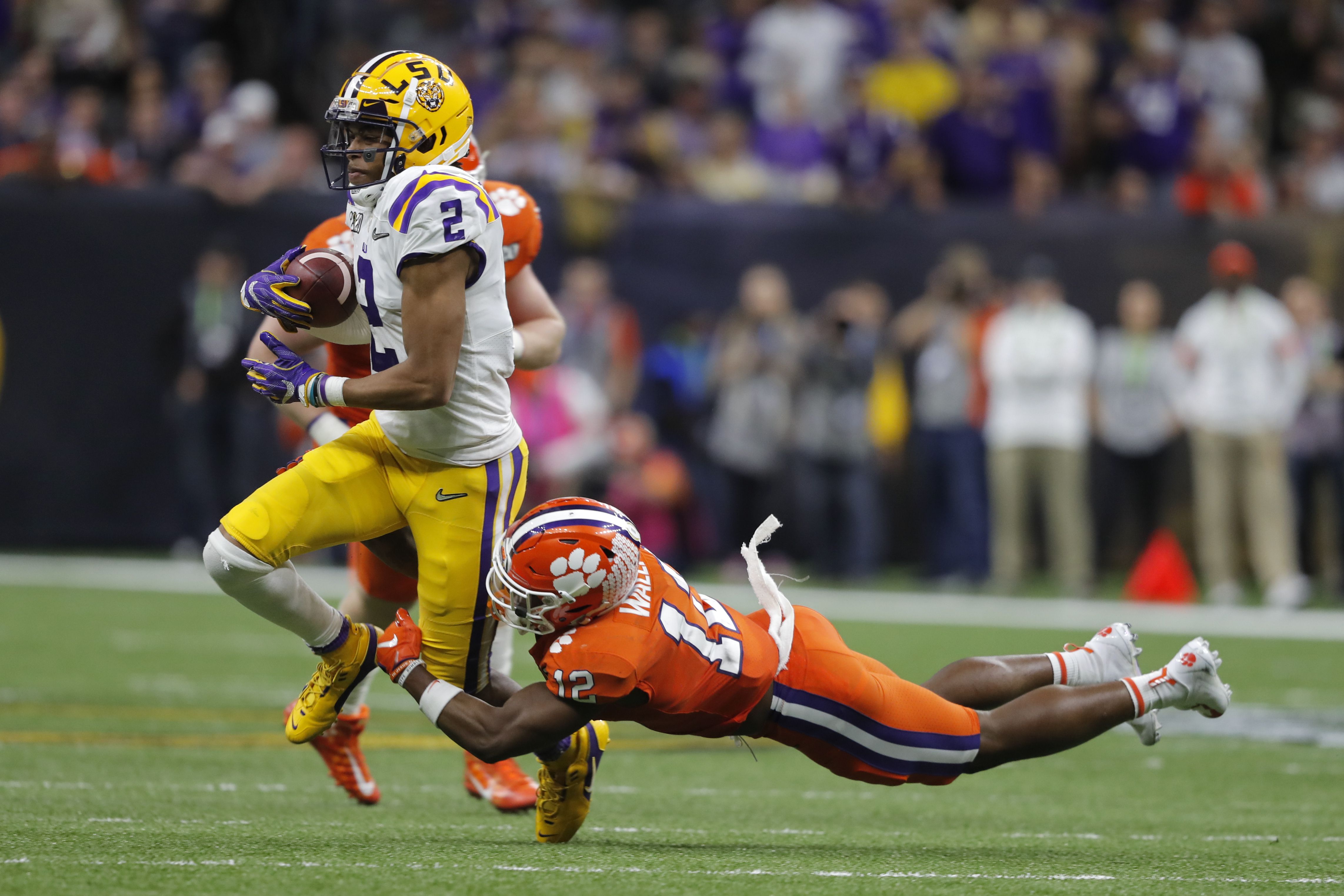 LSU center Lloyd Cushenberry III (79) and offensive tackle Saahdiq Charles  (77) celebrate a touchdown in the first half of an NCAA college football  game against Texas A&M in Baton Rouge, La.