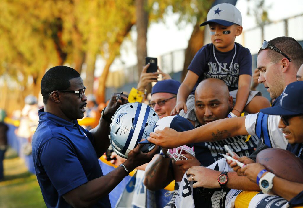 What did Michael Irvin do with his first paycheck from the Cowboys