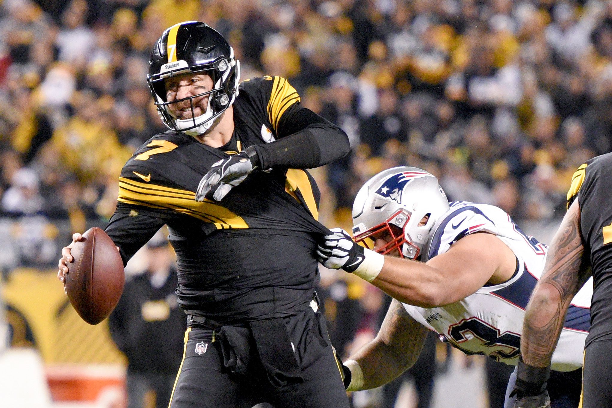 Ben Roethlisberger of the Pittsburgh Steelers is sacked by Michael