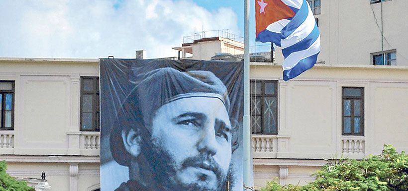 a-cuban-flag-flutters-at-half-mast-near-a-b-35779962