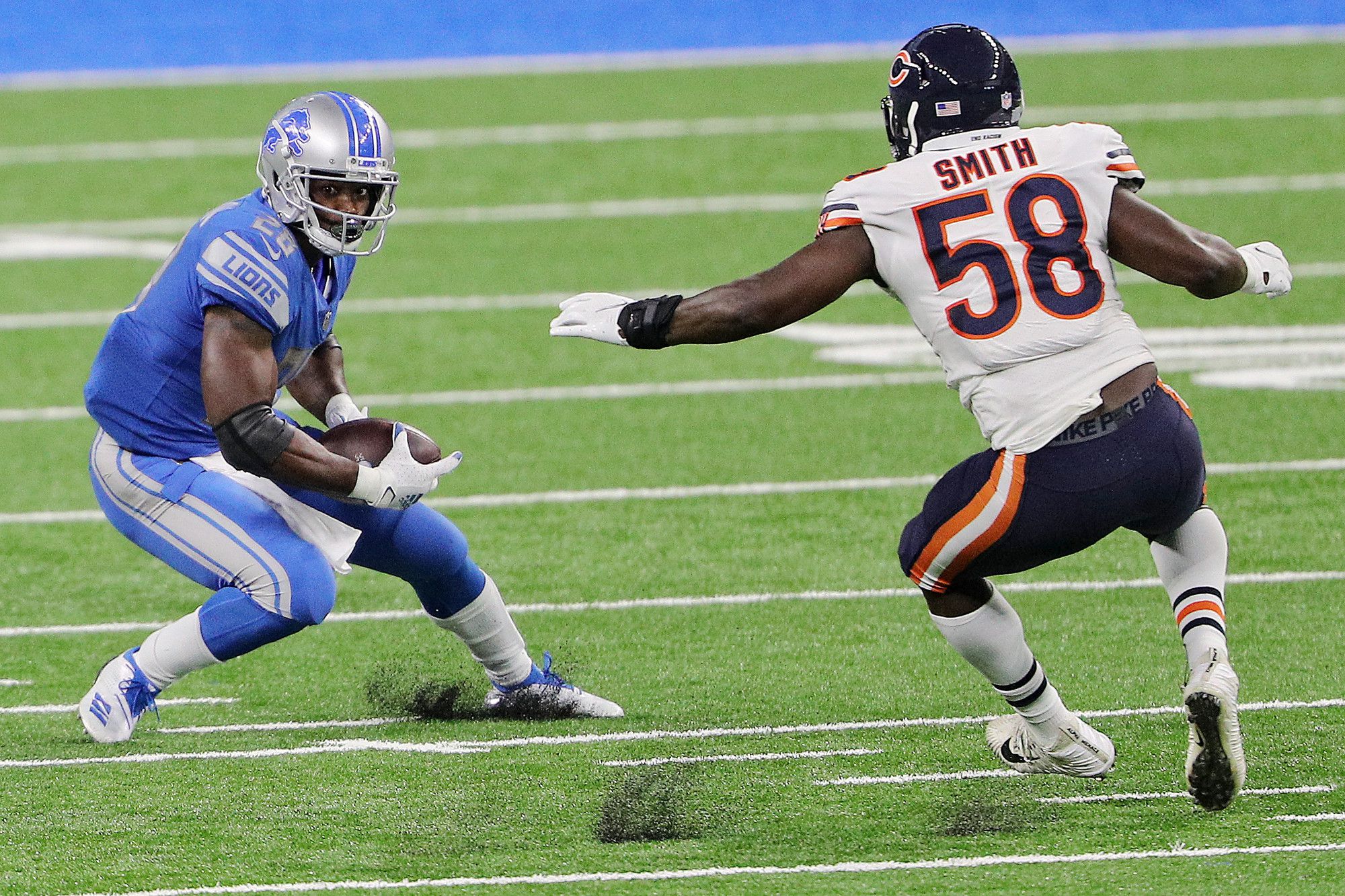 Atlanta Falcons wide receiver Julio Jones (11) is tackled by Detroit Lions  strong safety Duron Harmon (26) and defensive back Tracy Walker (21) during  the second half of an NFL football game