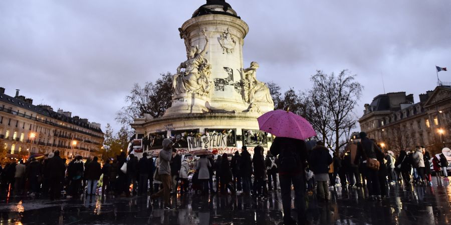 People gather at Place de la Republique (Republic Square) in Paris on