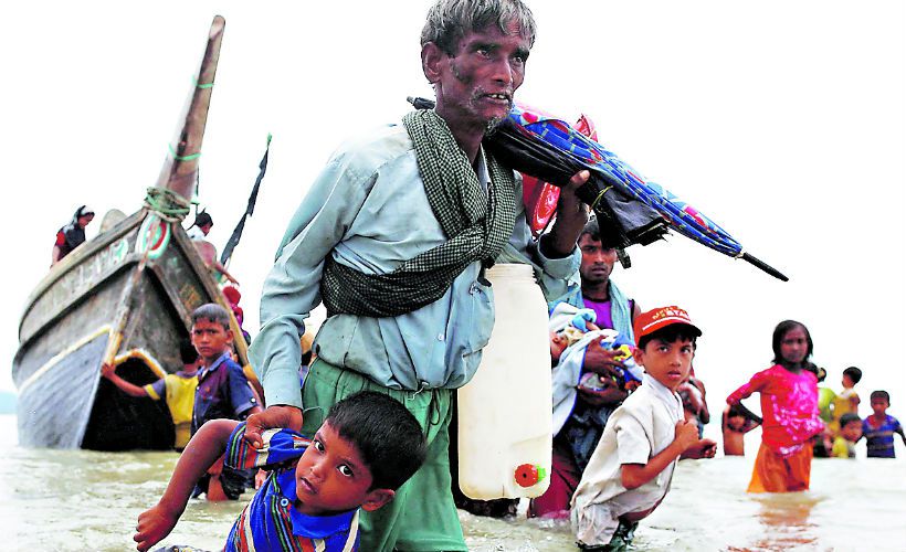 Imagen-A-Rohingya-refugee-man-pulls-a-child-40315779.jpg