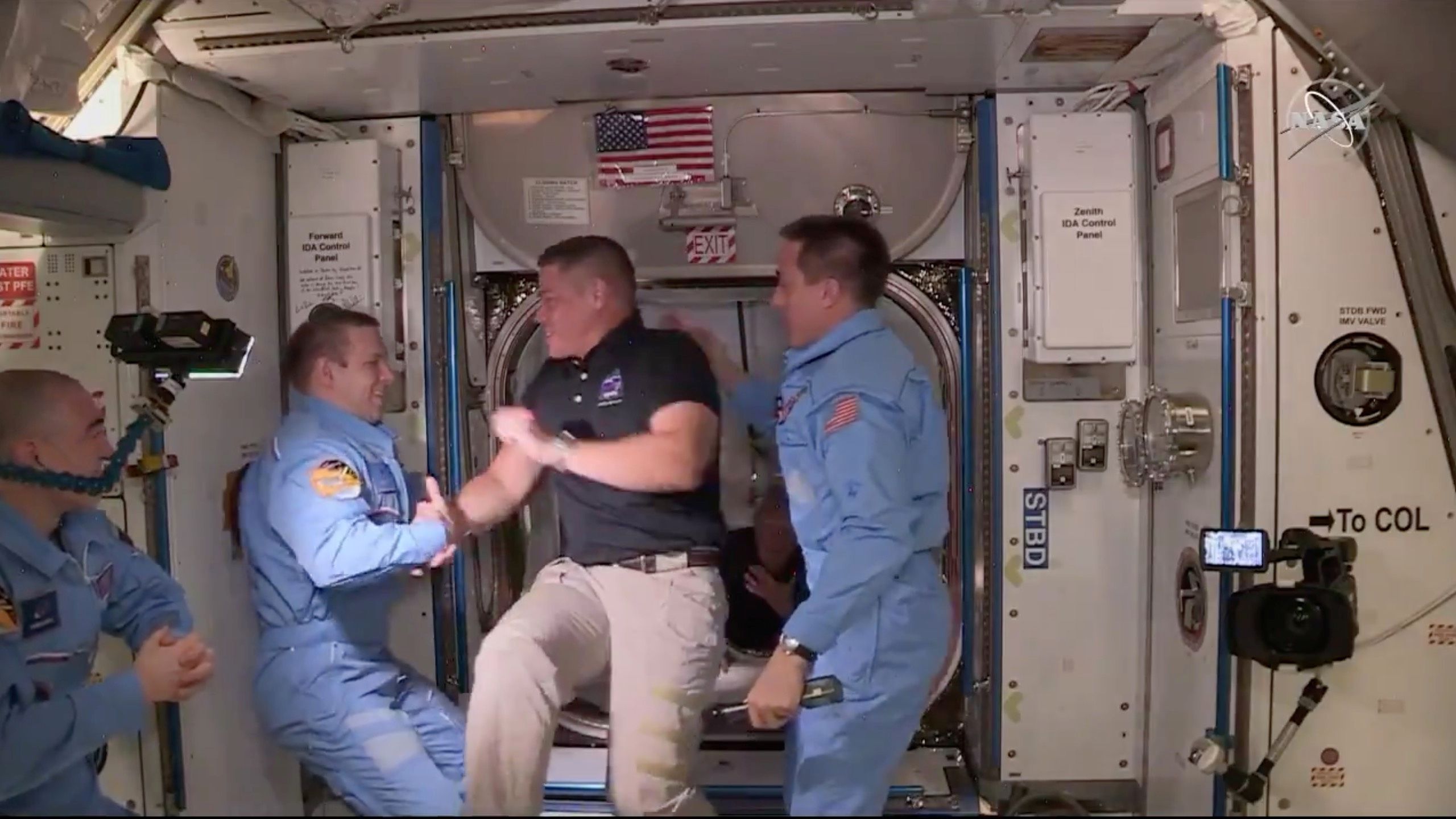 NASA astronaut Bob Behnken and Doug Hurley arrive at the International Space Station aboard SpaceX's Crew Dragon capsule in this still image taken from video