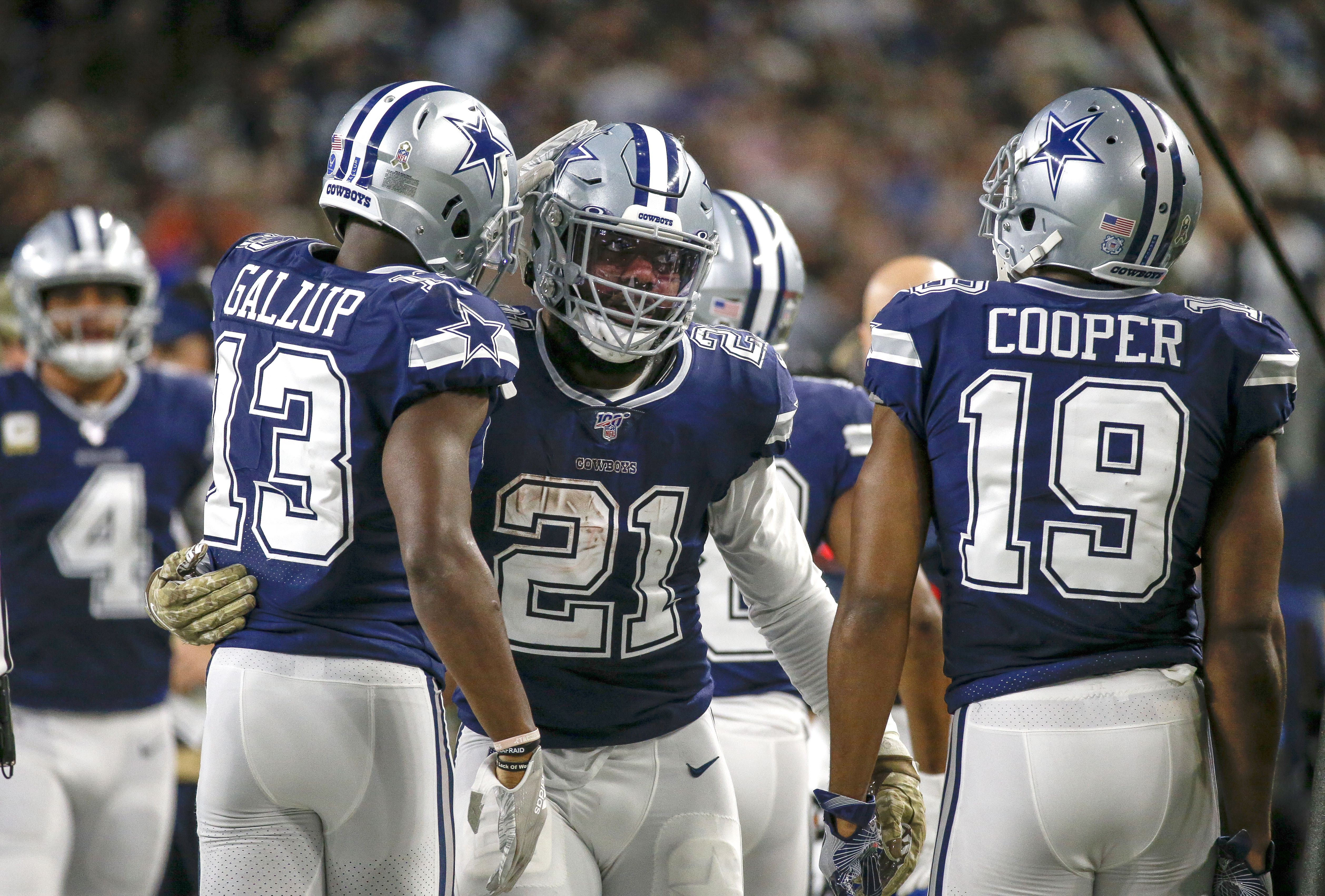 Dak Prescott, Ezekiel Elliott embrace at midfield after Cowboys-Patriots  game