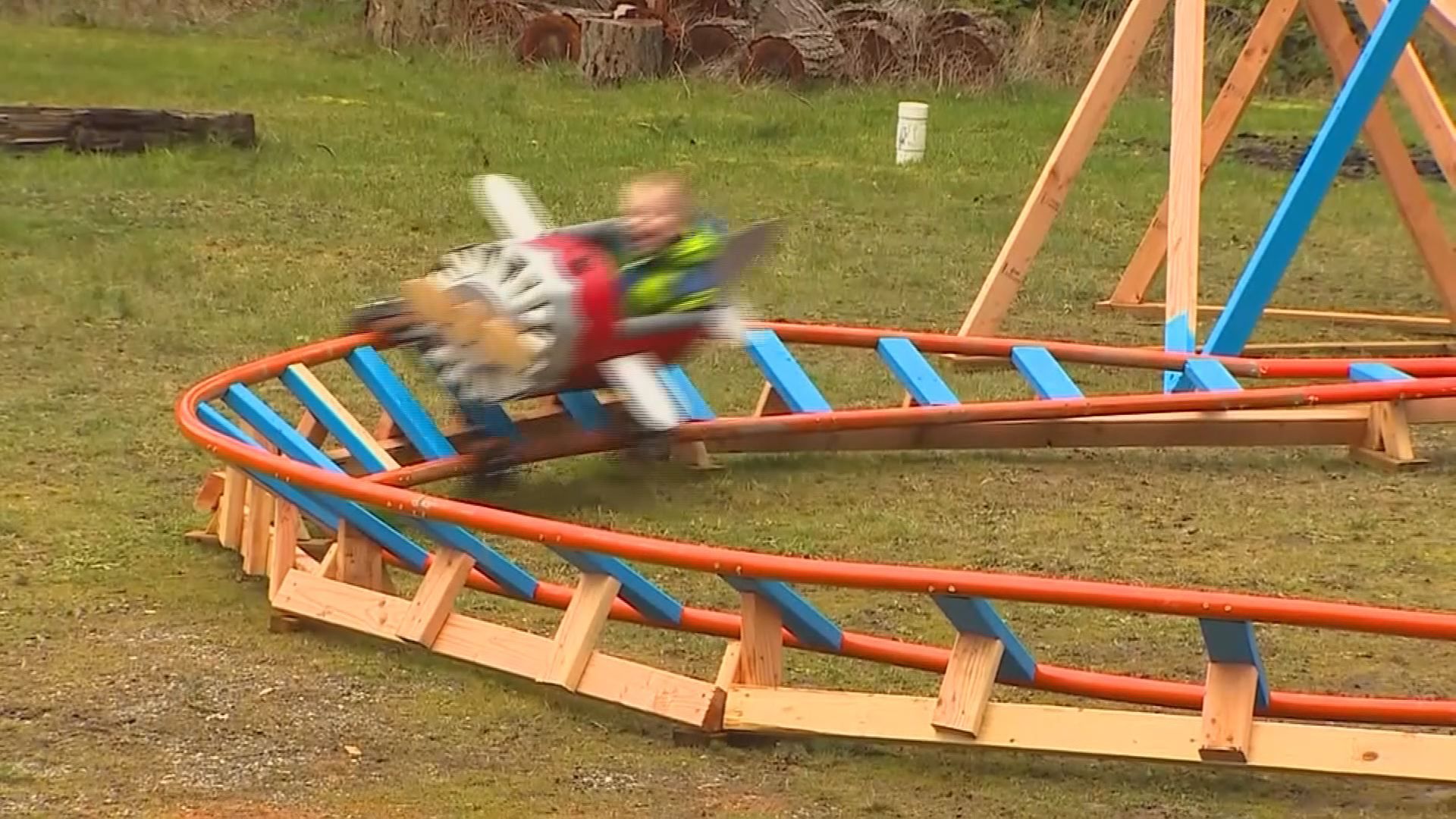 Dad builds back yard roller coaster for son