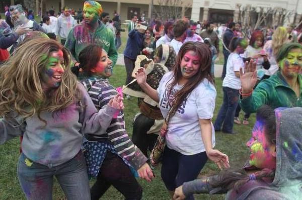 Why is Holi called the festival of colours and what do yellow, pink, green,  blue and purple symbolise?