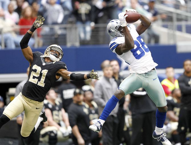 Dallas Cowboys free safety Gerald Sensabaugh (43) tries to bring down New  Orleans Saints wide receiver Marques Colston (12) during the first half of  an NFL football game Sunday, Dec. 23, 2012