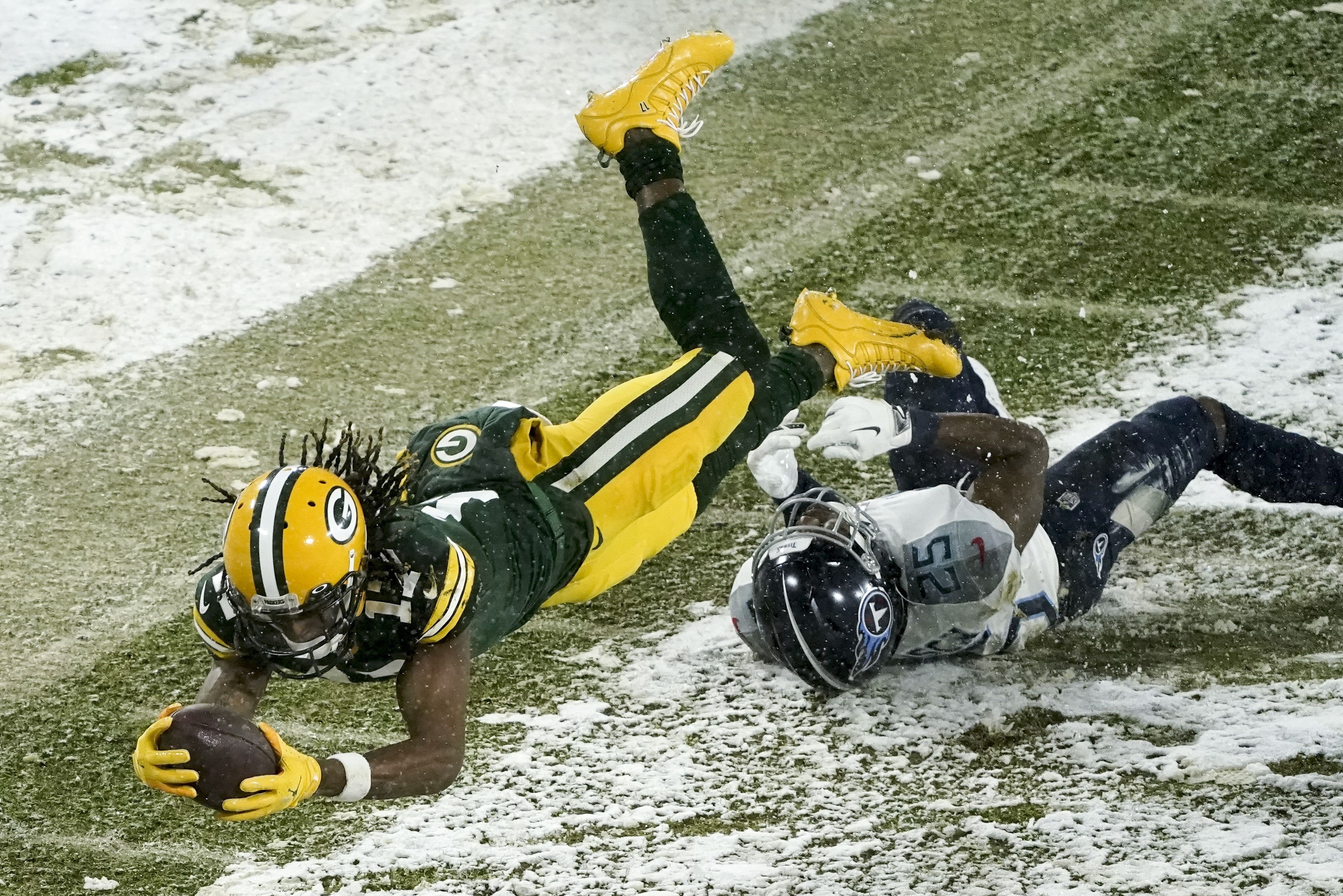 AJ Dillon gets his first career touchdown on a fourth down carry in the  snow 