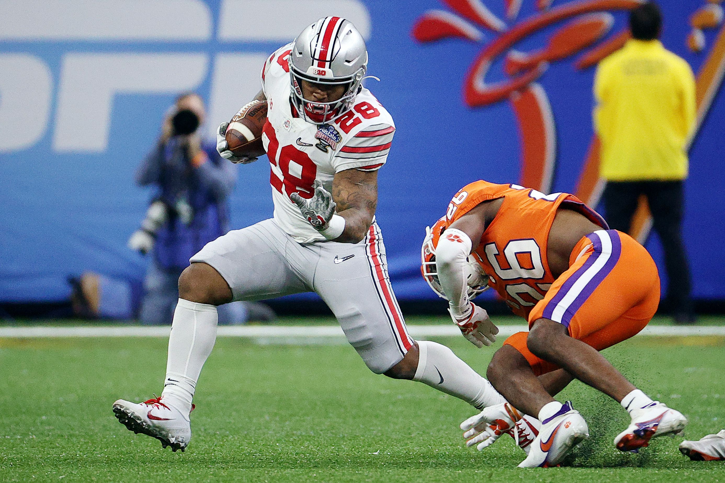 NEW ORLEANS, LA - JANUARY 01: Ohio State Buckeyes quarterback Justin Fields  (1) is tended to by medical staff after a targeting hit to his back during  the Allstate Sugar Bowl College