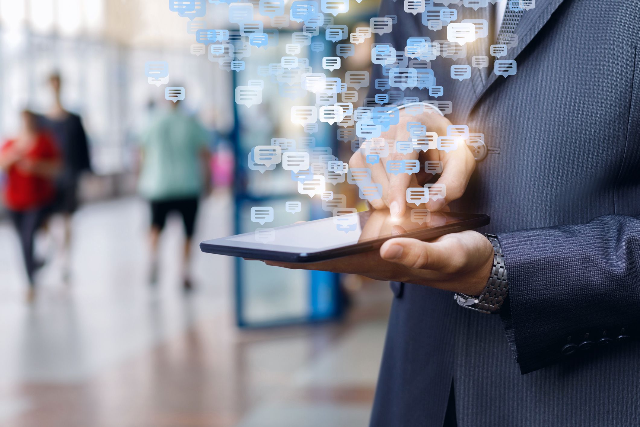 Businessman maintains correspondence on a tablet.