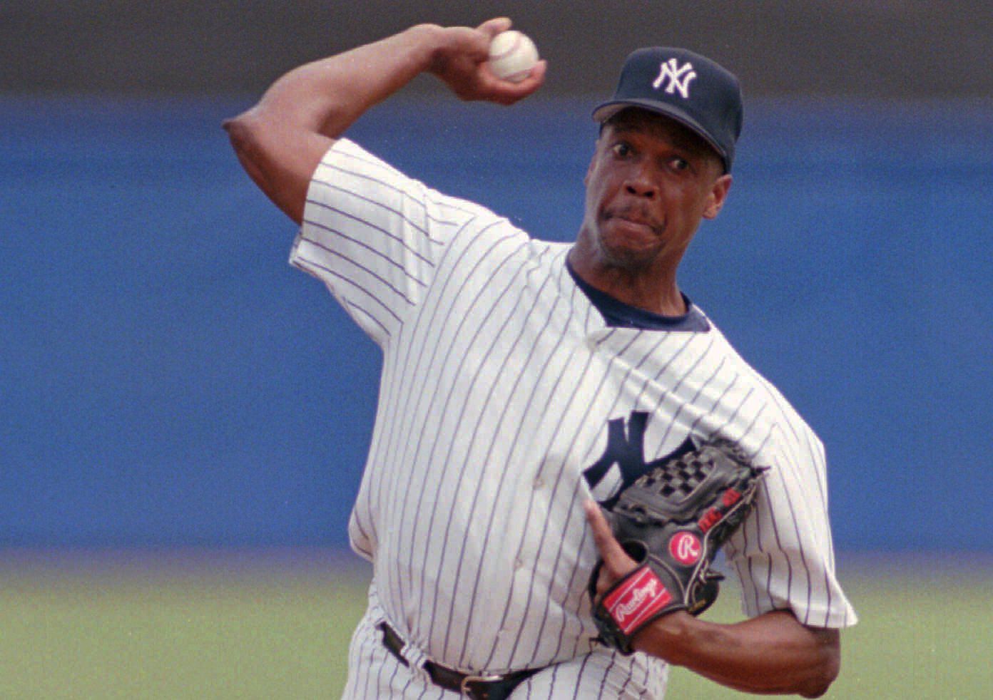 New York Mets Dwight Gooden eyes a pitch before getting a single