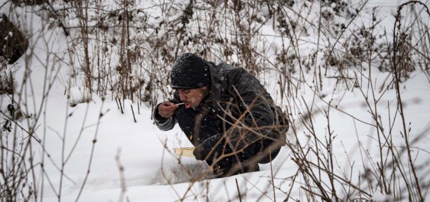 A-migrants-eats-his-m-17889474-e1484232999851-840x395.jpg