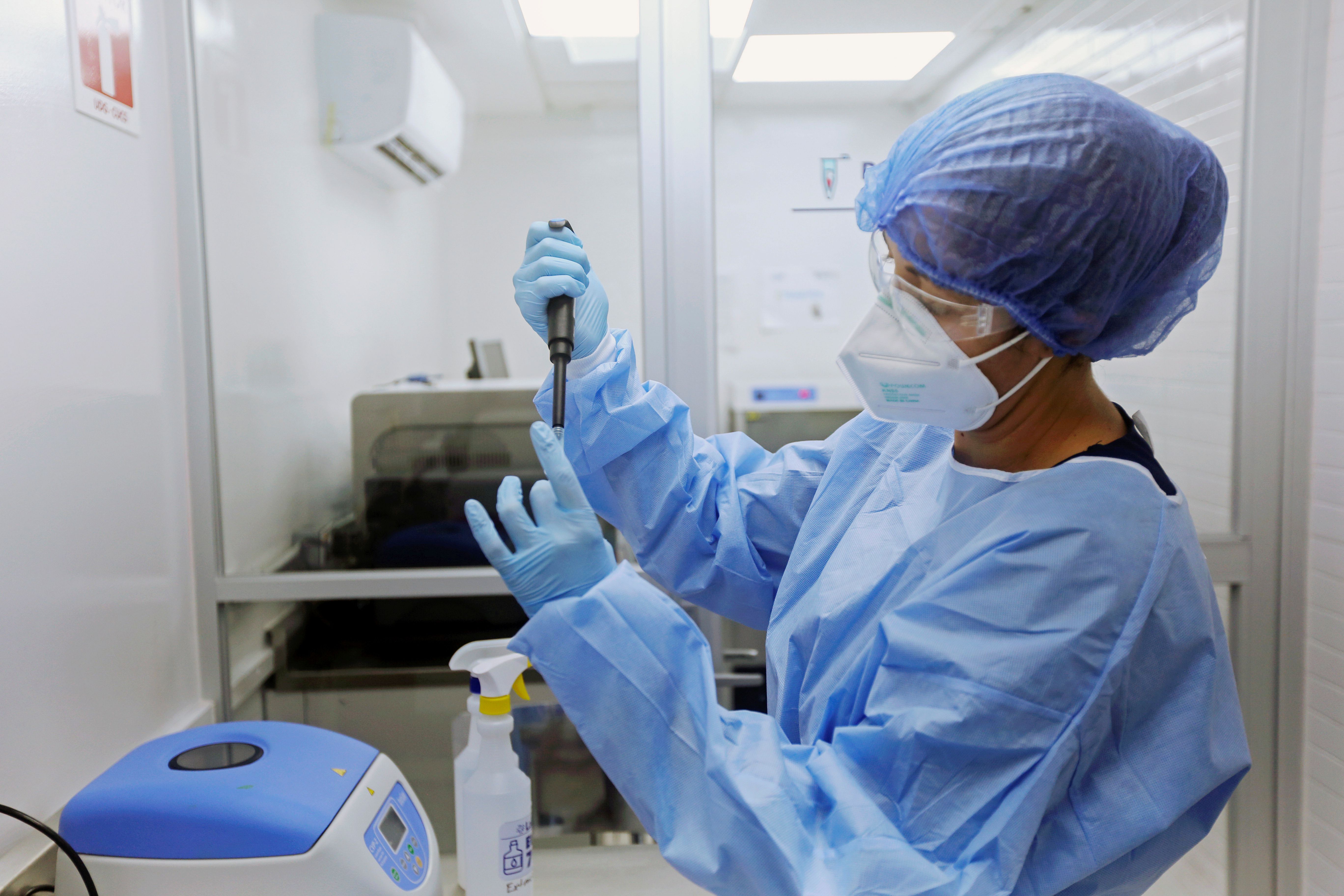 A lab technician performs a step in the testing procedure to investigate if a new strain of the coronavirus disease (COVID-19) detected in the state of Jalisco could be a Mexican variant of SARS-CoV-2, in Guadalajara