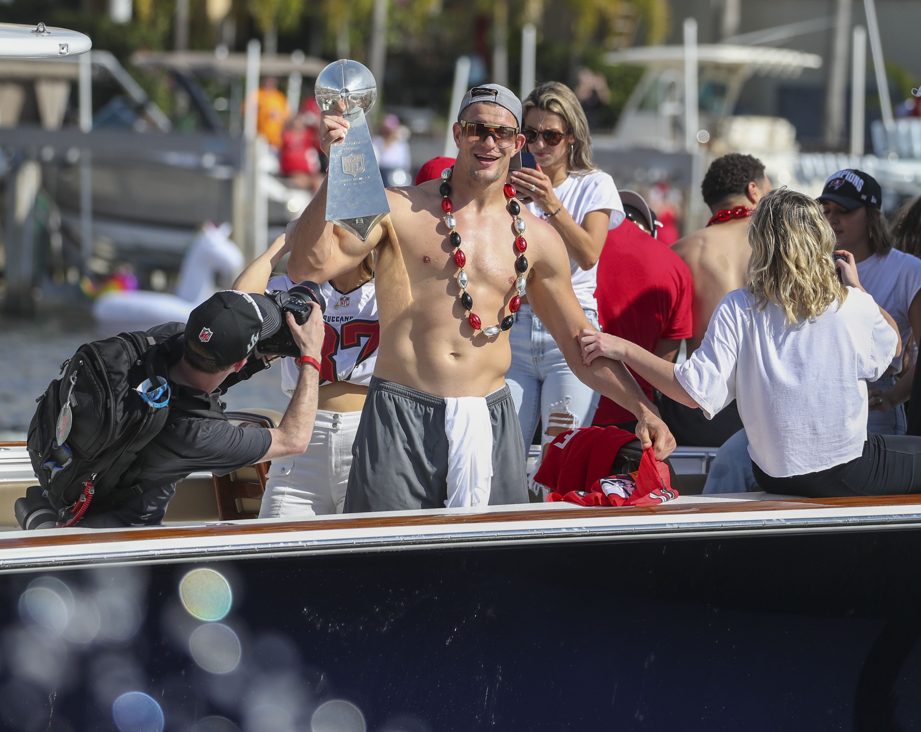 Tom Brady Tosses Super Bowl Trophy From Boat to Boat During Victory Flotilla