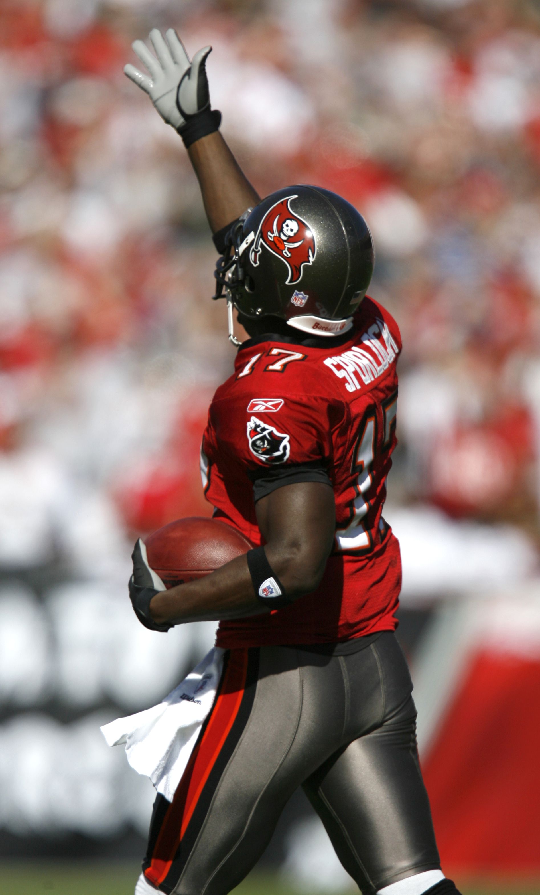 Tampa Bay Buccaneers' wide receiver Micheal Spurlock (17) takes a kick-off  return for a 90-yard touchdown putting his name in the record books as  scoring the first kick-off-return touchdown in the Buccaneers'