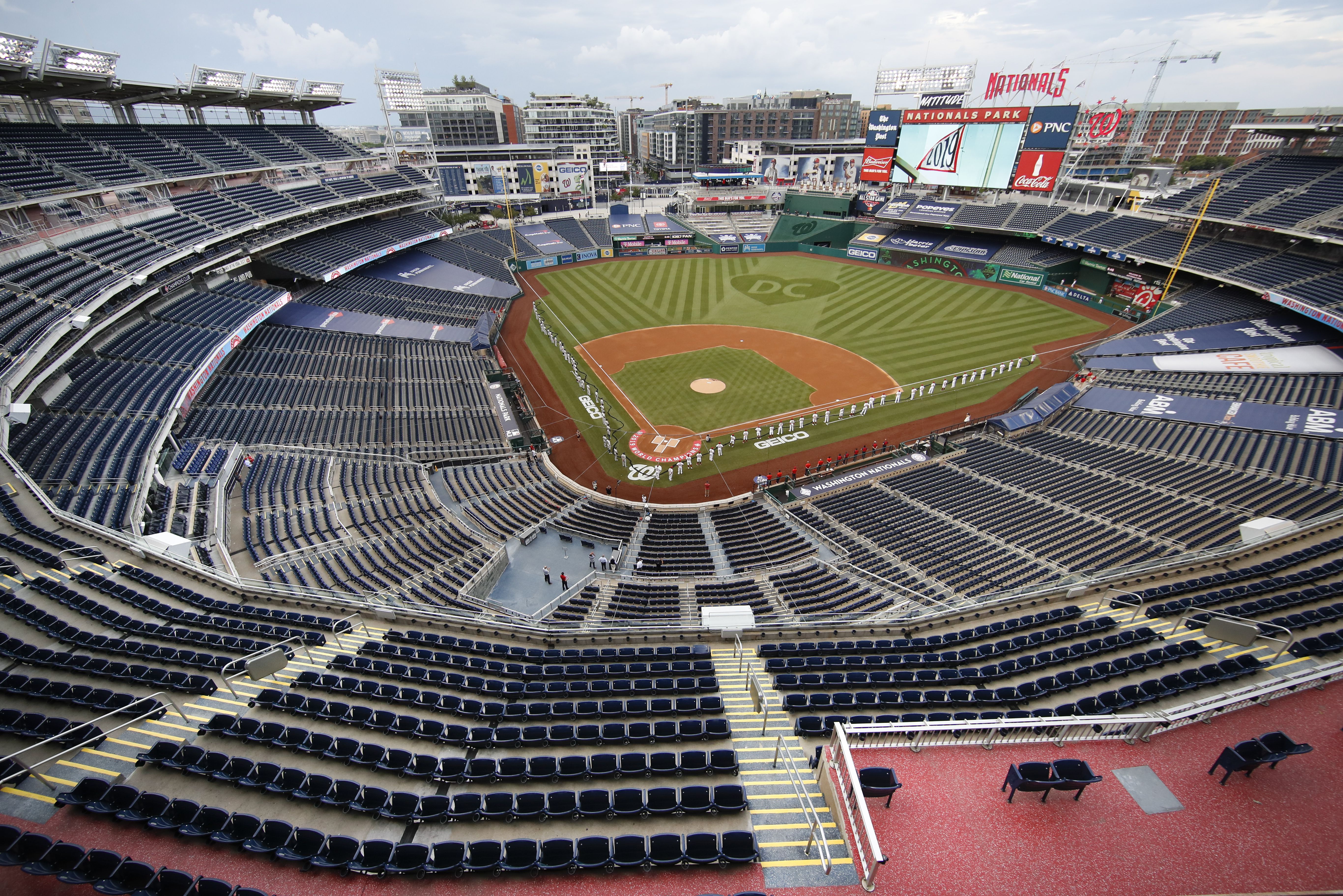 Empty stands, masked players as baseball returns