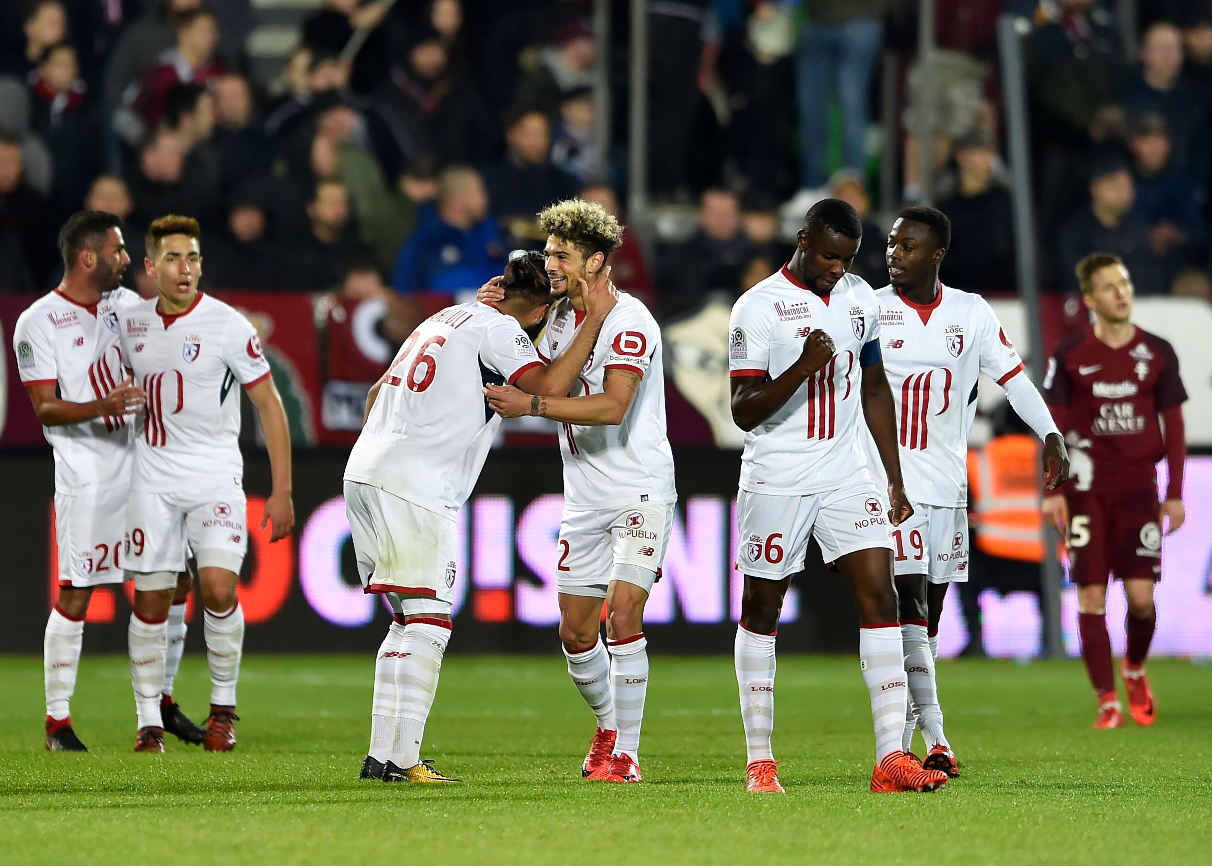 Lille's French midfielder Farès Bahlouli (3-L) celebrates with teamma