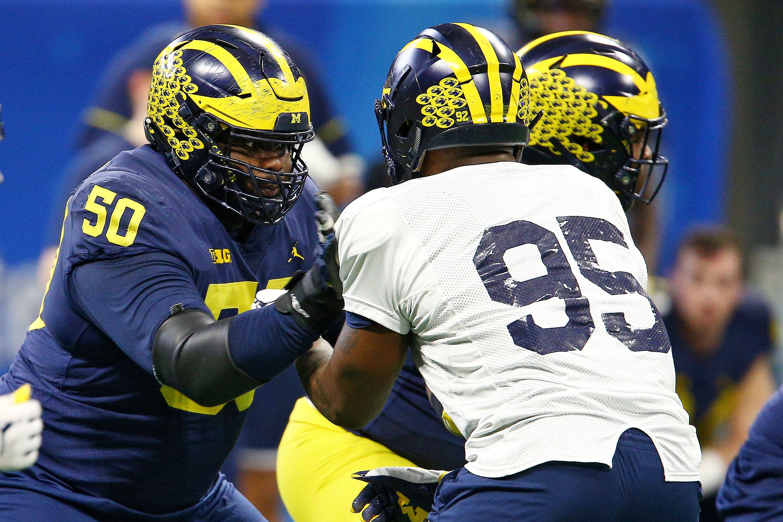 Michigan's Mike Onwenu sheds weight, open to playing DL in NFL 