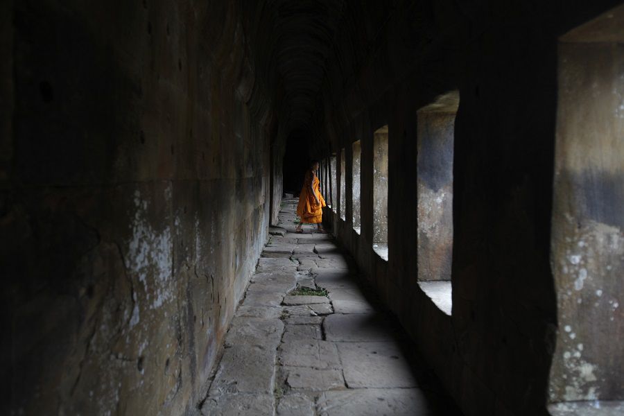 A Buddhist monk visits the Preah Vihear temple on the border between Thailand and Cambodia