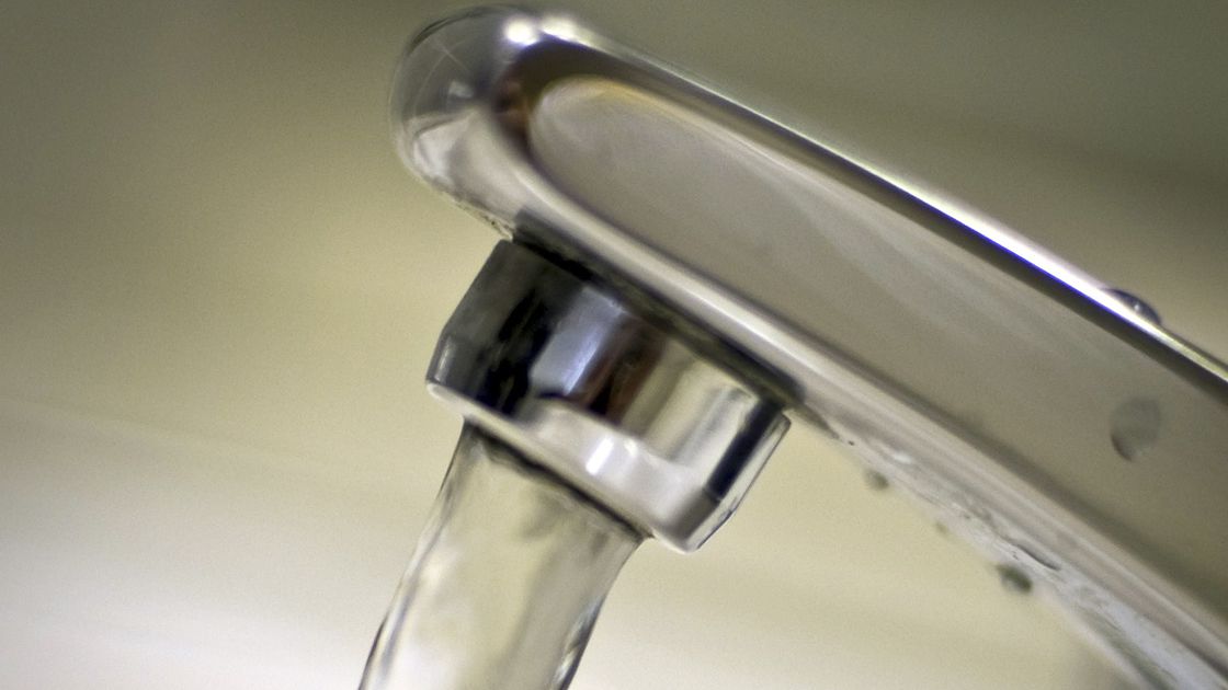 Water runs from a tap in a building in Osaka on March 23, 2011.