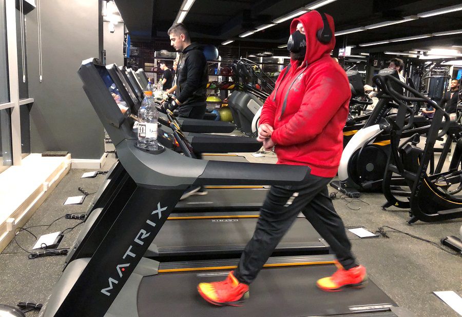 A man exercises at a gym in Amman