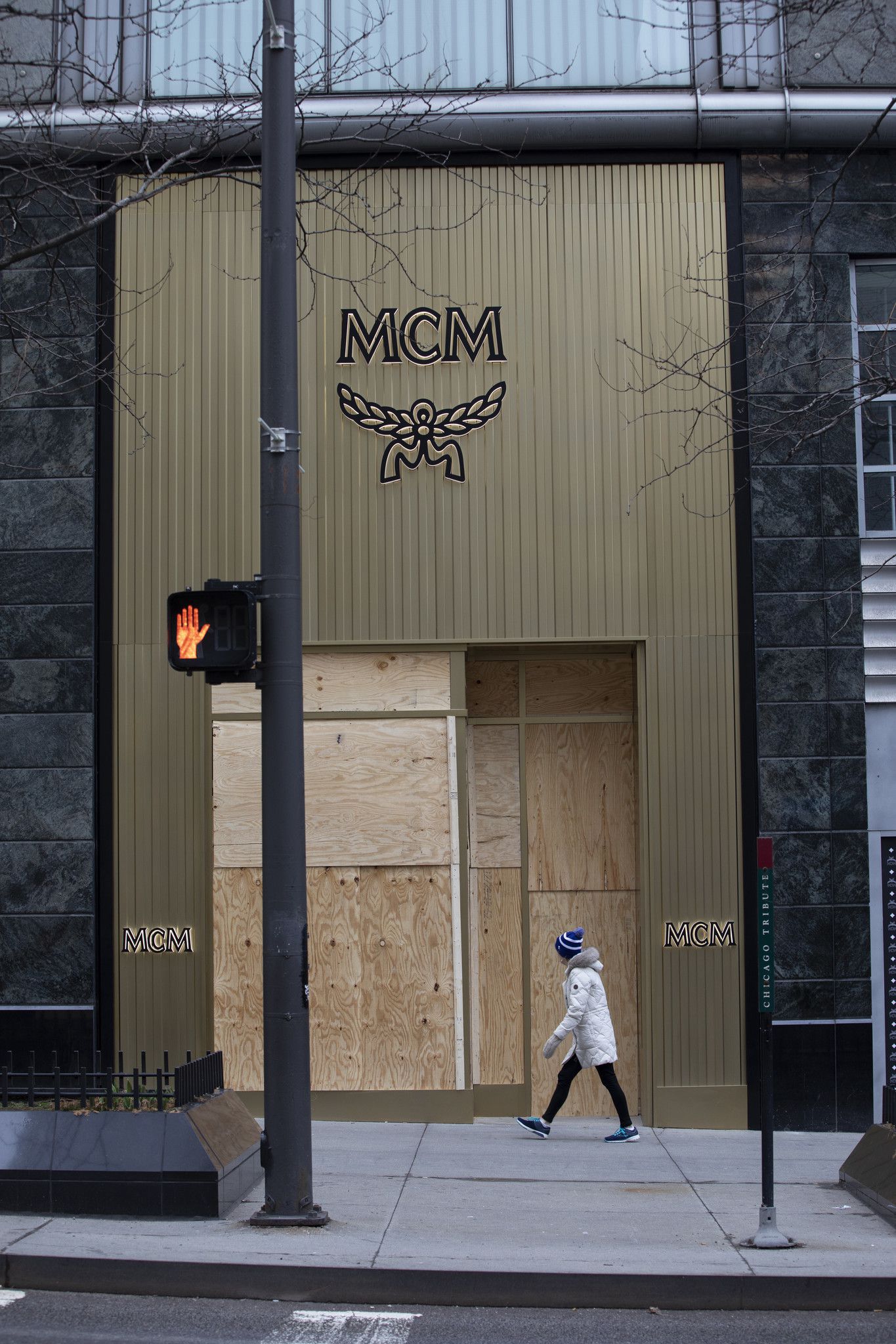 Empty windows, boarded-up storefronts dot the Magnificent Mile