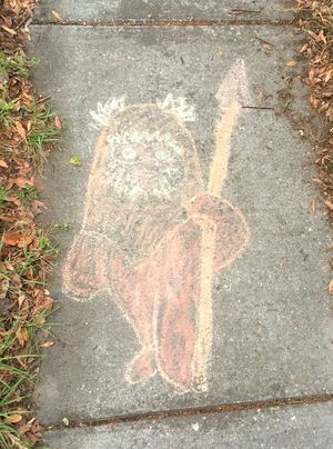 As rain falls on Tampa Bay, sidewalk chalk art melts away