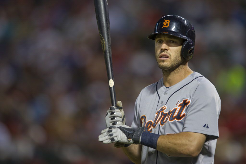 Texas Rangers' Ian Kinsler crosses the plate after hitting a home