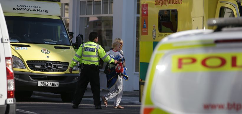 Members of the emergency services work near Parsons Green underground