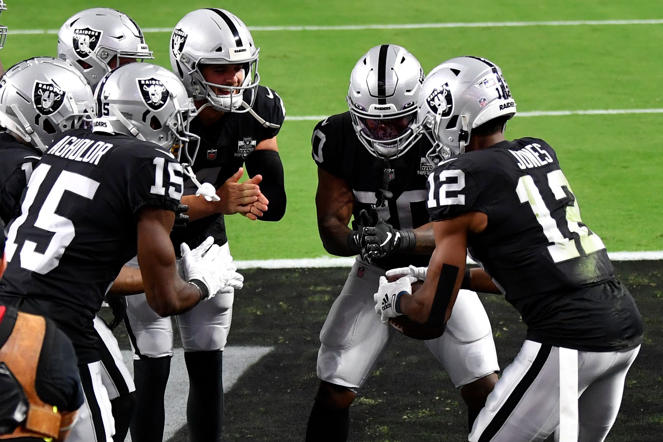 Las Vegas Raiders wide receiver Zay Jones #12 celebrates with running back  Jalen Richard #30, quarterback Derek Carr #4, wide receivers Hunter Renfrow  #13 and Nelson Agholor #15 after scoring a touch