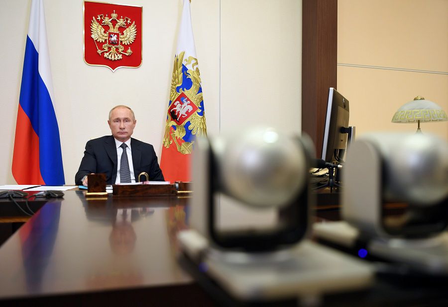 Russian President Putin chairs a meeting via video link outside Moscow