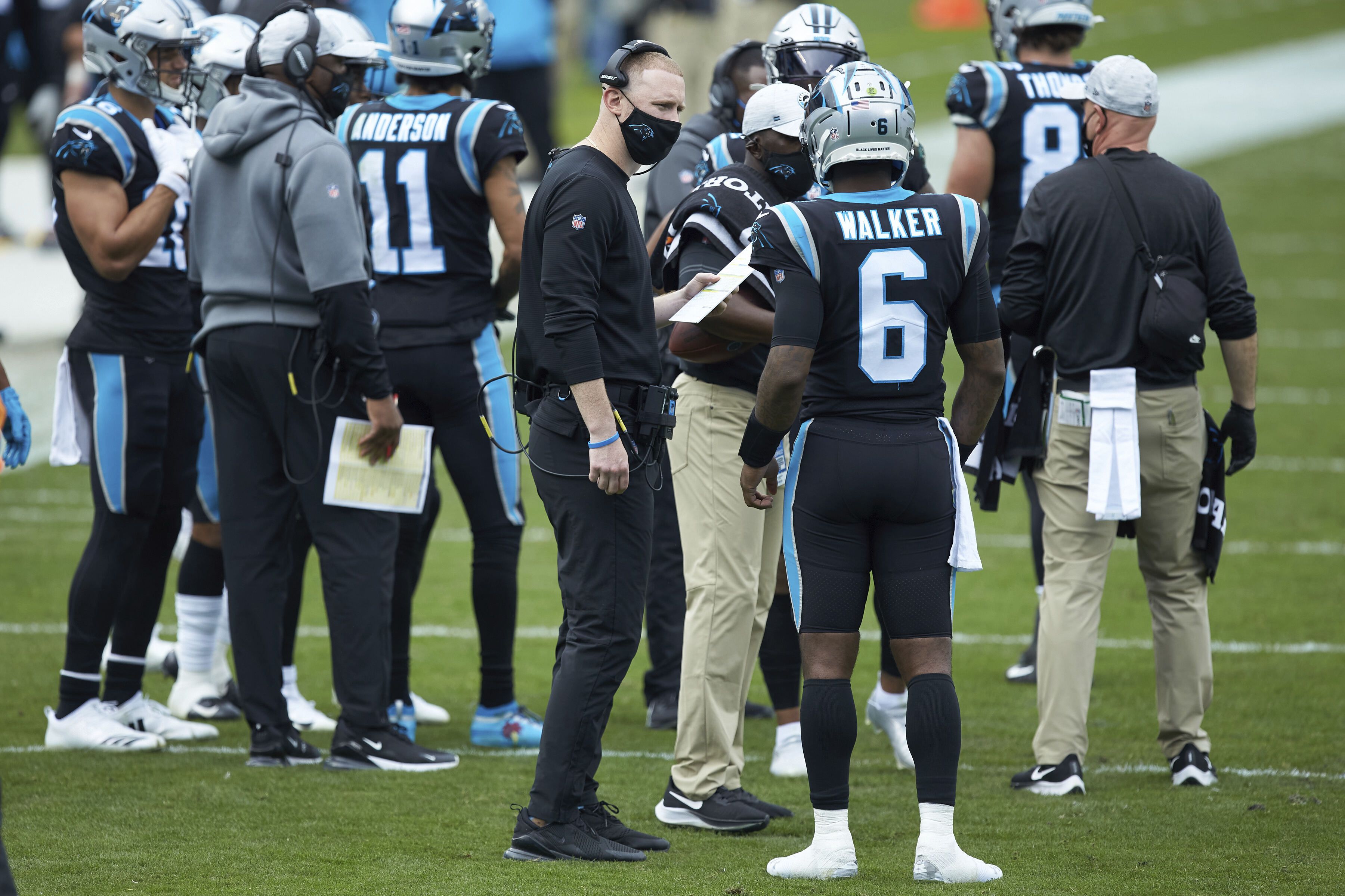 FILE - In this Dec. 27, 2020, file photo, Atlanta Falcons head coach Raheem  Morris walks on the sideline during the first half of an NFL football game  against the Kansas City