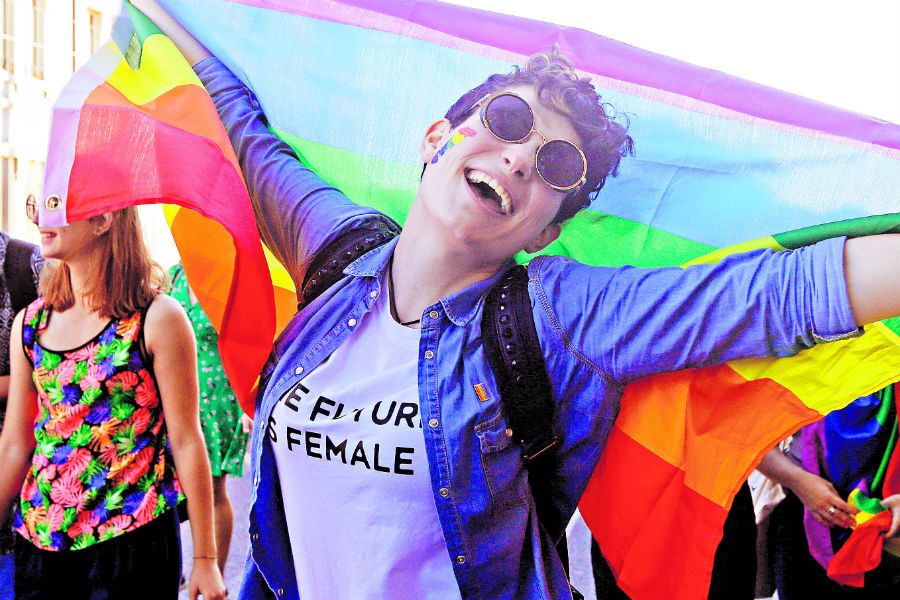 A woman holds a rainbow flag during the Les (42164151)