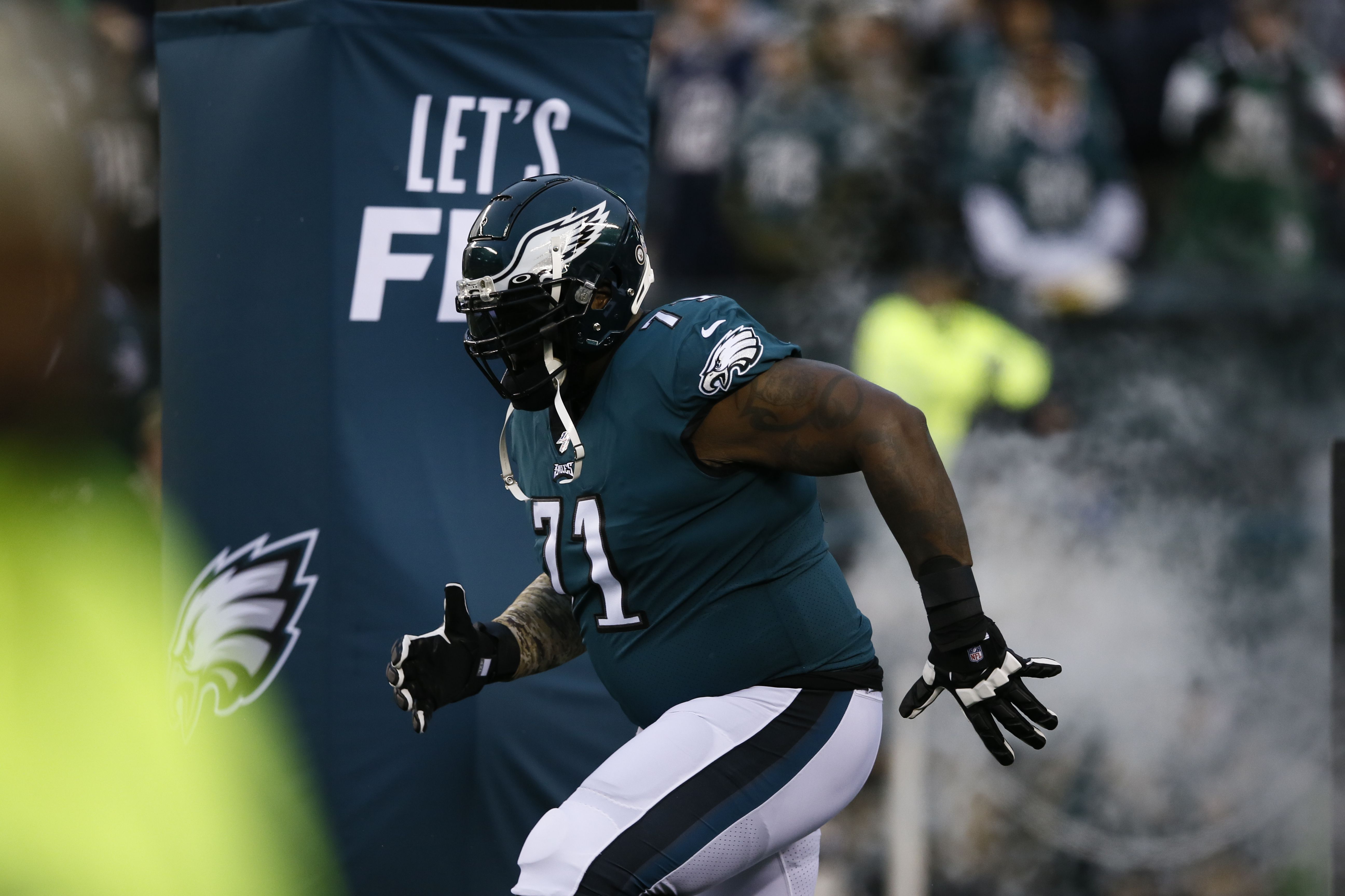 Lane Johnson carries Jason Peters' jersey out as Eagles take the