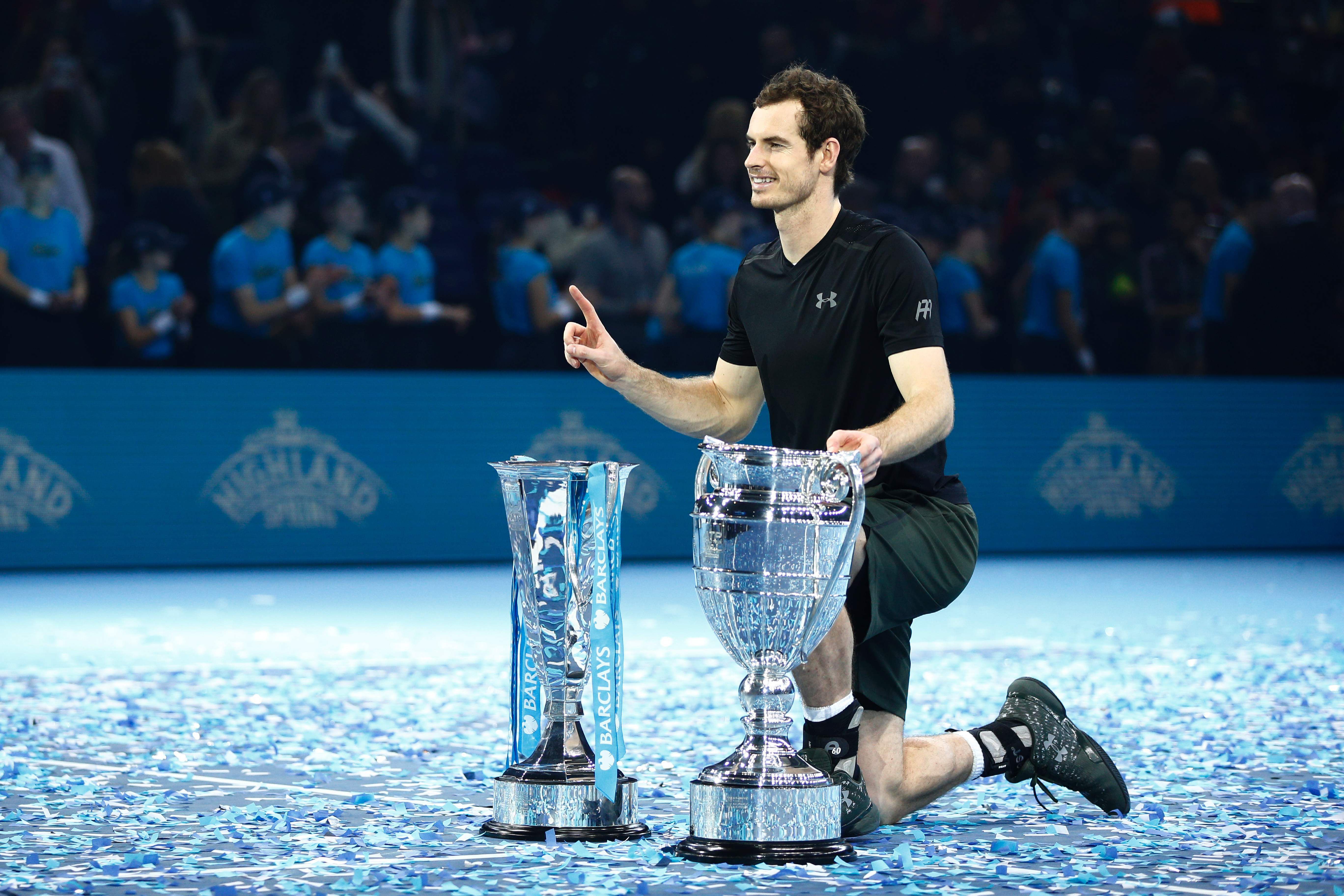 Britain's Andy Murray poses with both the ATP World Number One trophy