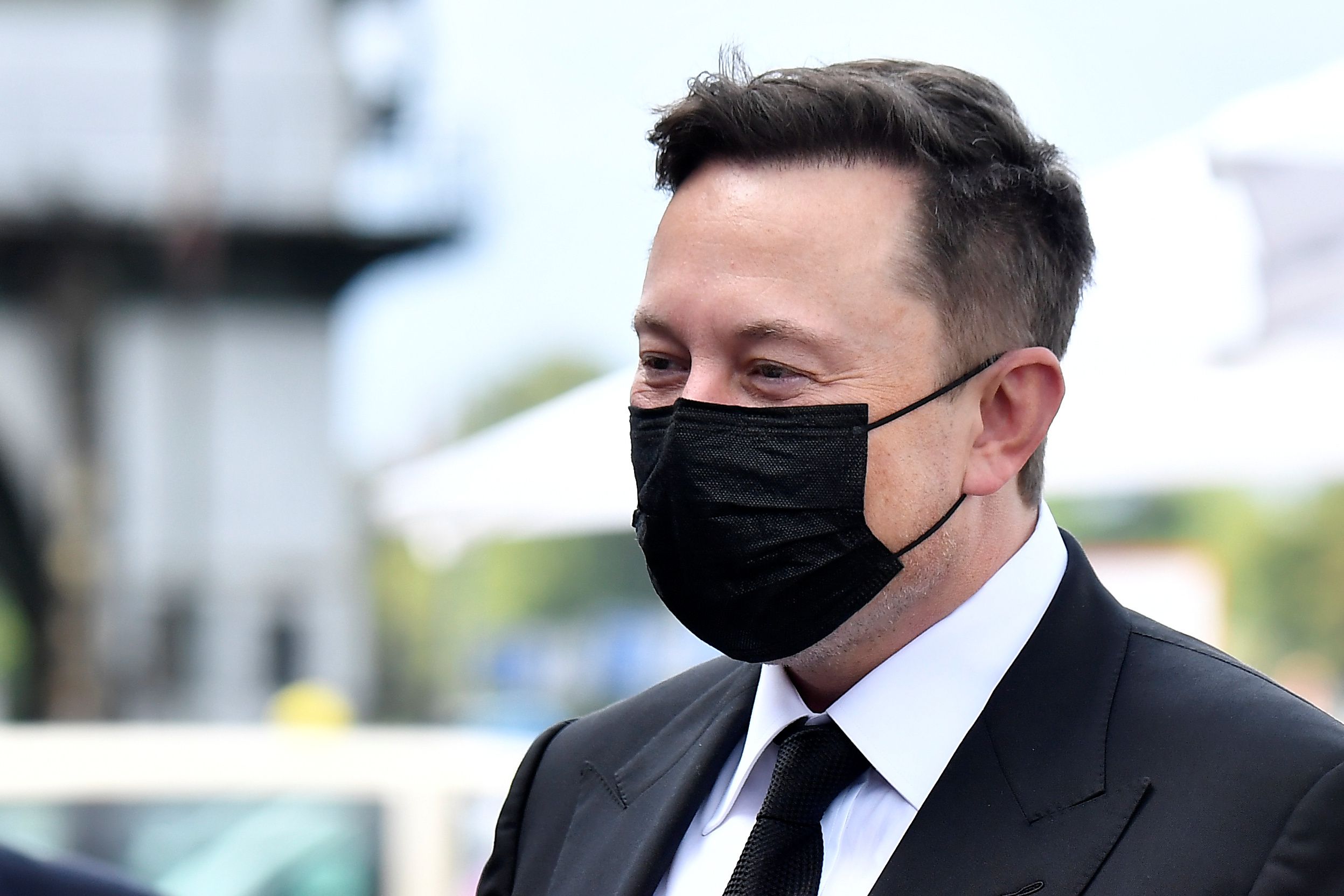 Elon Musk wears a protective mask as he arrives to attend a meeting with the leadership of the conservative CDU/CSU parliamentary group, in Berlin